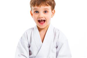 Happy boy in karate gi