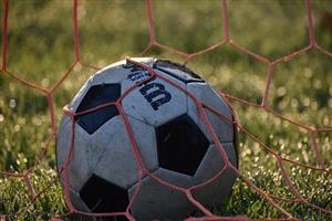 Wilson's Soccer Ball Wrapped In Goal Net